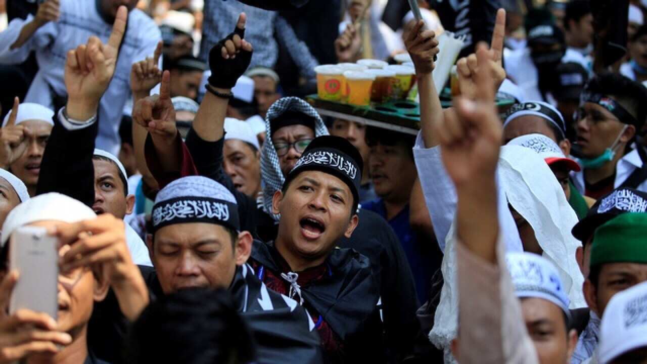 Protesters shout during an action against the burning of a flag by 3 members of Nahdlatul Ulama the biggest Moslem organisation in Indonesia.
