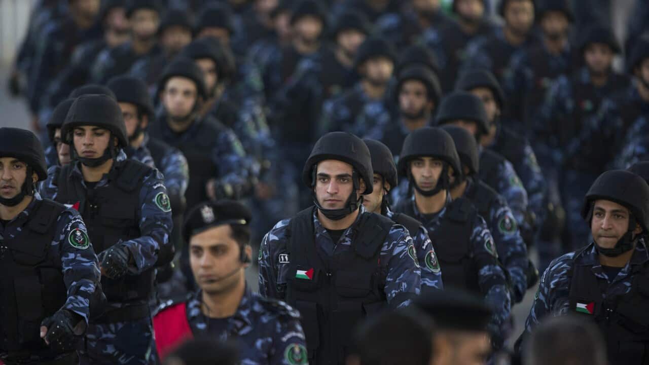 Palestinian security forces march, as they mark the 50th anniversary of the Fatah movement in the West Bank city of Ramallah, Wednesday, Dec. 31, 2014. (AAP)