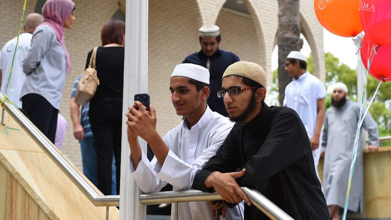 File: Young Muslim men are seen prior to prayer at the Lakemba Mosque in south west Sydney, Saturday, Oct. 31, 2015.