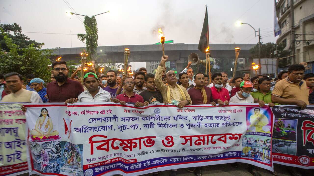 Bangladeshi Hindu community members join torch procession blocking Shahabagh road during a protest against communal attackBangladesh, 22 October 2021.