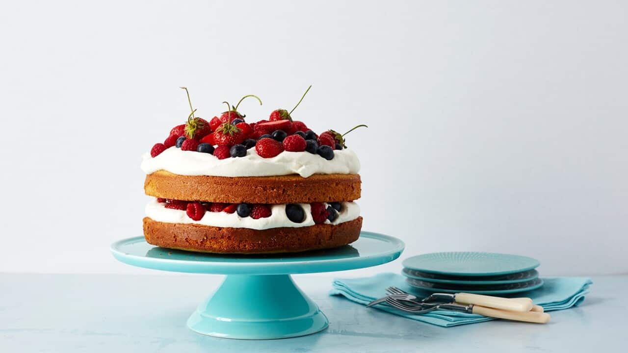 Spelt layer cake with whipped cream and berries