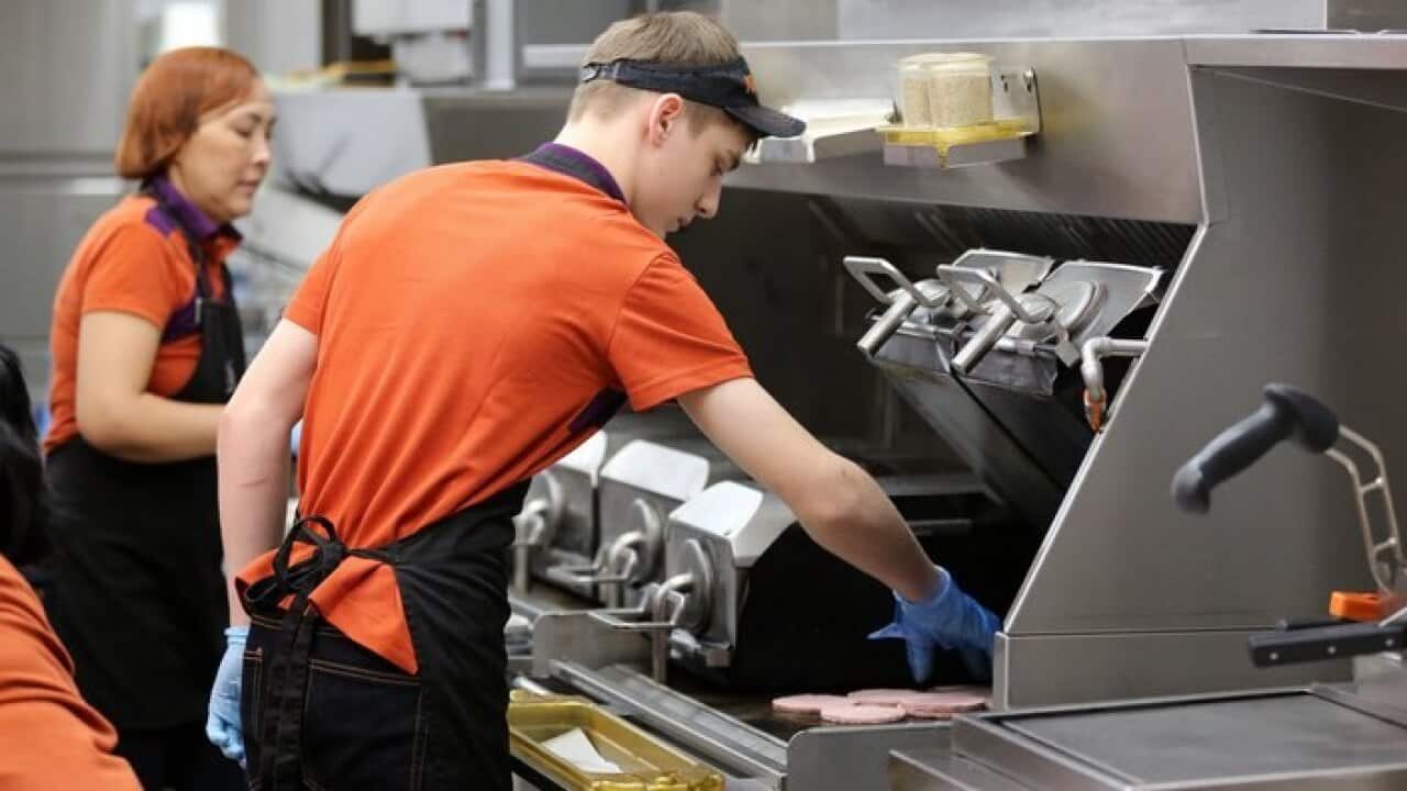 Employees at work at a fast food chain.