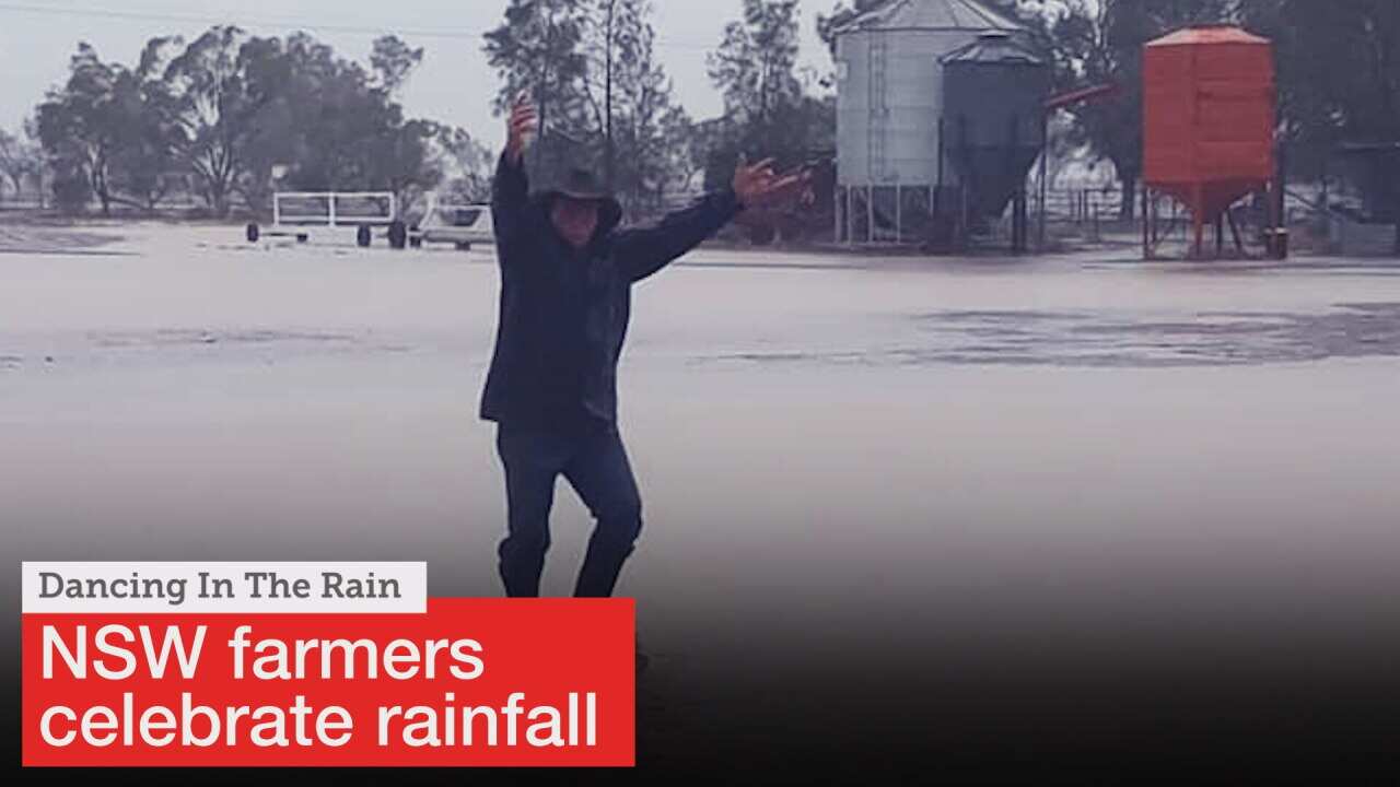 Farmer dances in rain