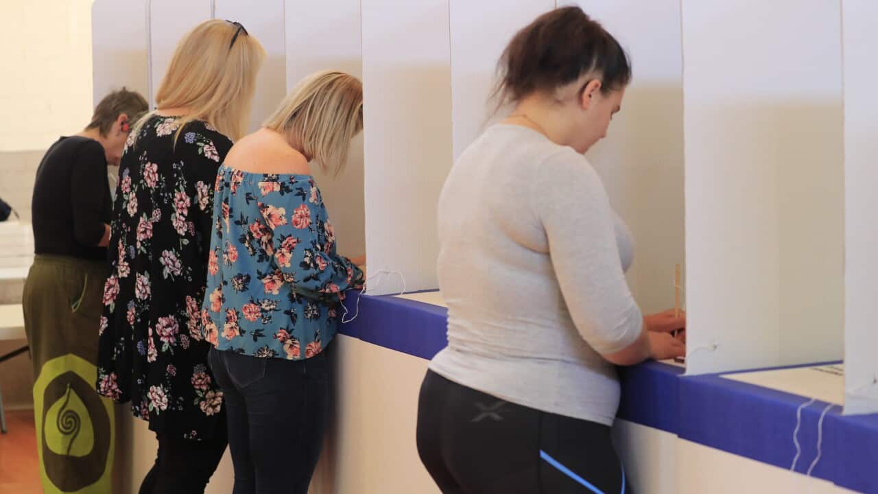 Voters cast their ballots in the Tasmanian State Election at Sorell Memorial Hall, Saturday, March 3, 2018. (AAP Image/Rob Blakers) NO ARCHIVING