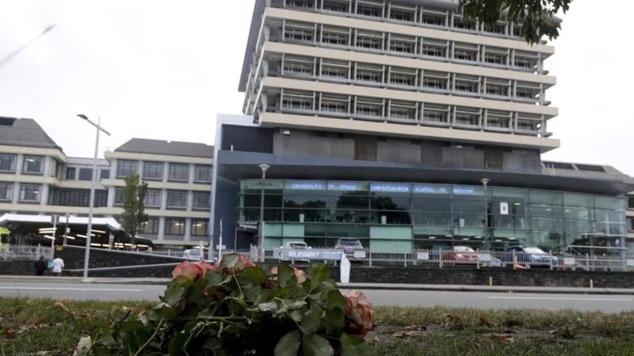 A bouquet of flowers is placed near Christchurch Hospital.