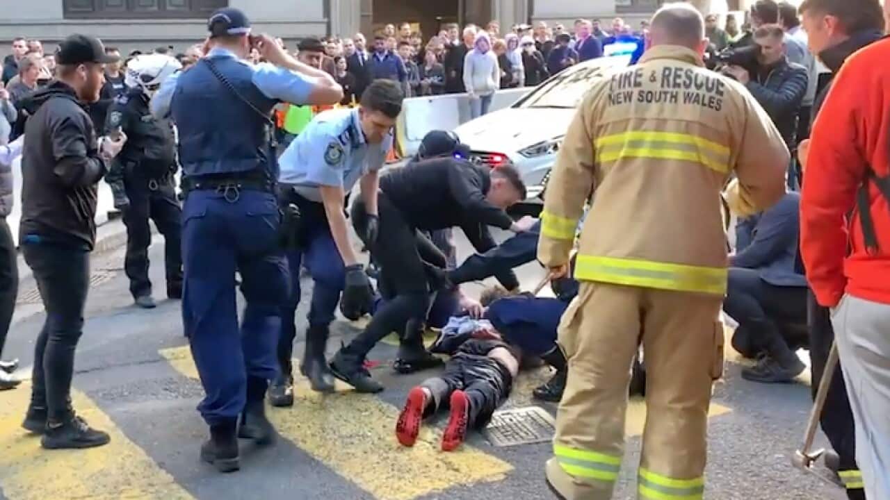 A video image shows a man being arrested following the incident in Sydney's CBD