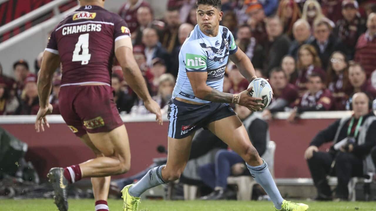 Latrell Mitchell of the Blues with the ball during Game 1 of the 2019 State of Origin series between the NSW Blues and the Queensland Maroons at Suncorp Stadium in Brisbane, Wednesday, June 5, 2019. (AAP Image/Glenn Hunt) NO ARCHIVING, EDITORIAL USE ONLY