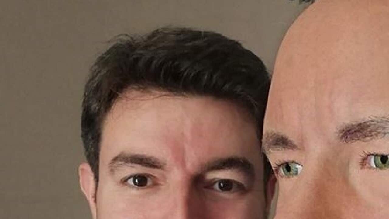 Artist Theodoros Kokkinidis taking a selfie alongside the wax sculpture of actor Tom Hanks