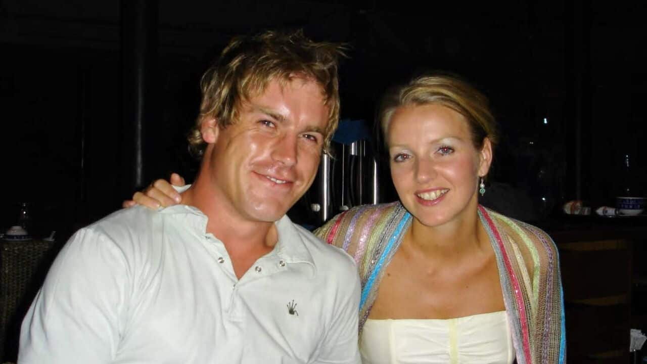 a photo of a young blonde couple (man and woman) out at dinner