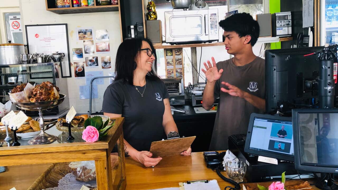 Rafael and Acting Assistant Principal Amanda Joyce work together at the cafe.