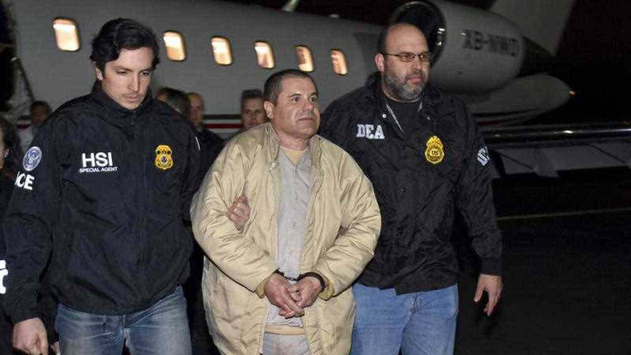 Authorities escort Joaquin "El Chapo" Guzman from a plane at Long Island MacArthur Airport.