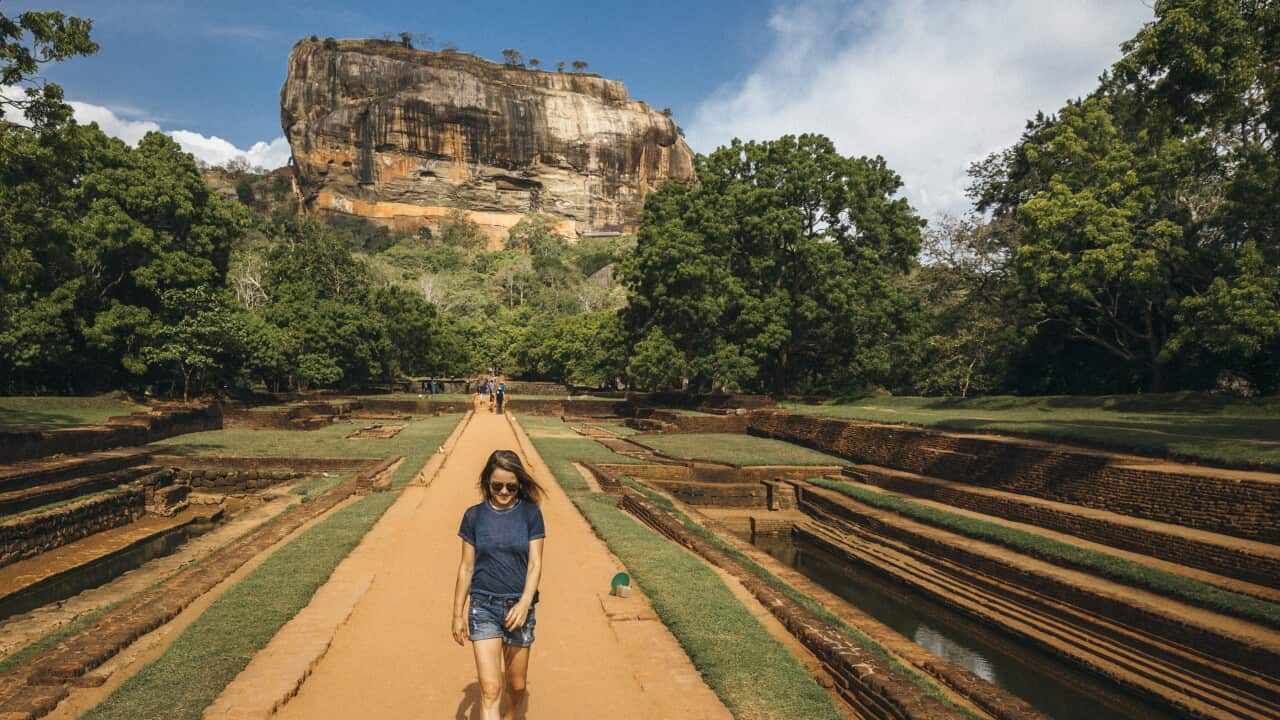 Woman against Sigiriya Lion Rock, Central Province, Sri Lanka