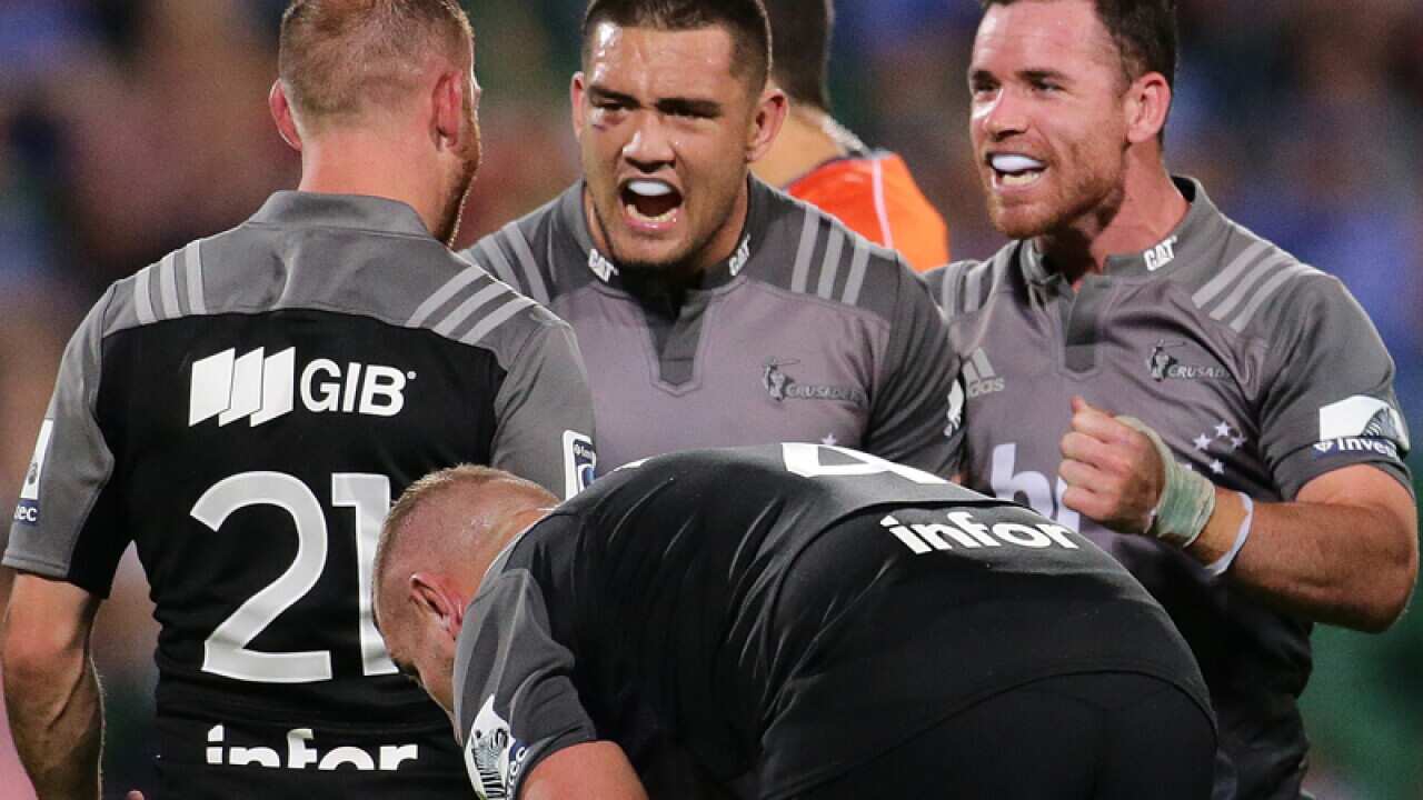 Crusaders players celebrate their win