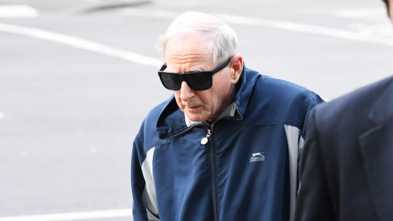 Former school principal and Marist Brother Gerard McNamara enters the County Court of Victoria in Melbourne