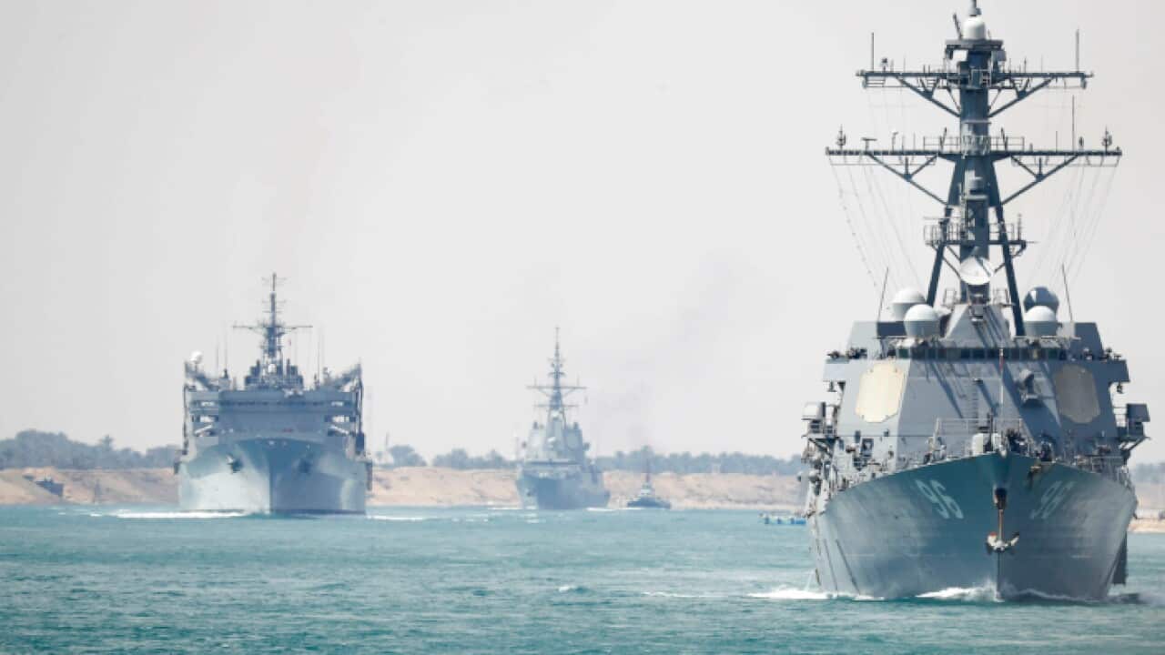 he U.S. Navy, the Abraham Lincoln Carrier Strike Group transits the Suez Canal in Egypt before being deployed to the Persian Gulf