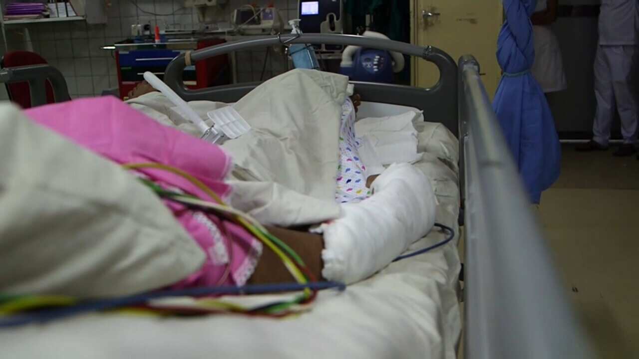 Thr 28-year-old Melbourne resident is currently bedridden in Sri Lanka's national hospital, surrounded by scores of blast victims.