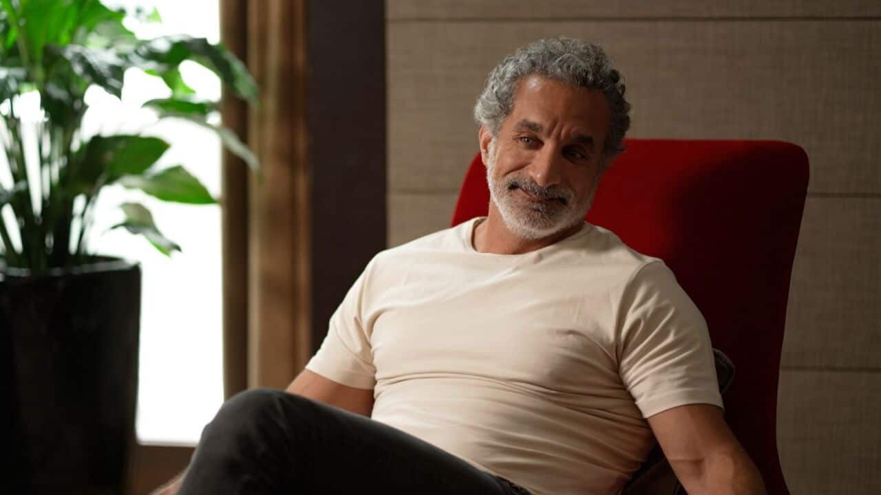 A man in a red chair.