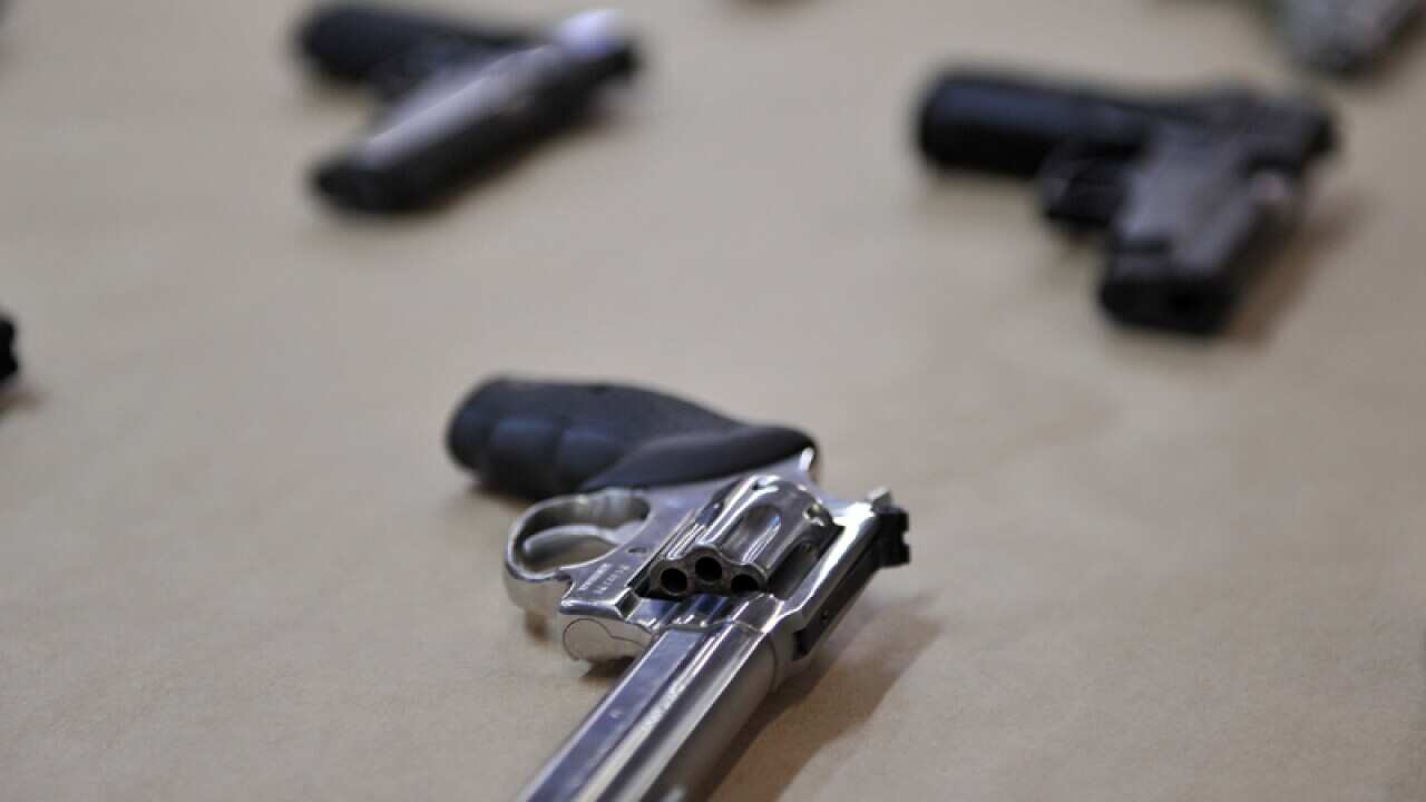 A selection of hand guns are displayed at the Police Centre in Sydney