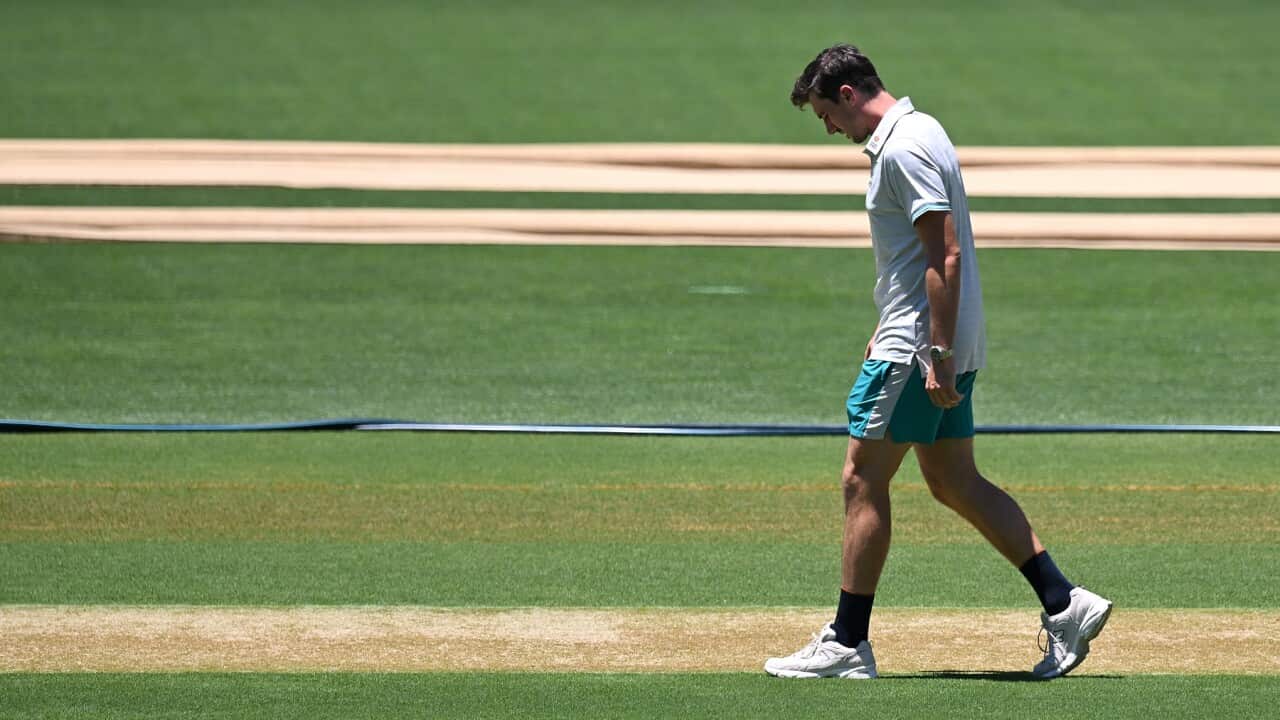 Australian captain Pat Cummins inspects the pitch during the Australian Cricket Team training session at the Adelaide Oval, Adelaide, Wednesday, December 15, 2021