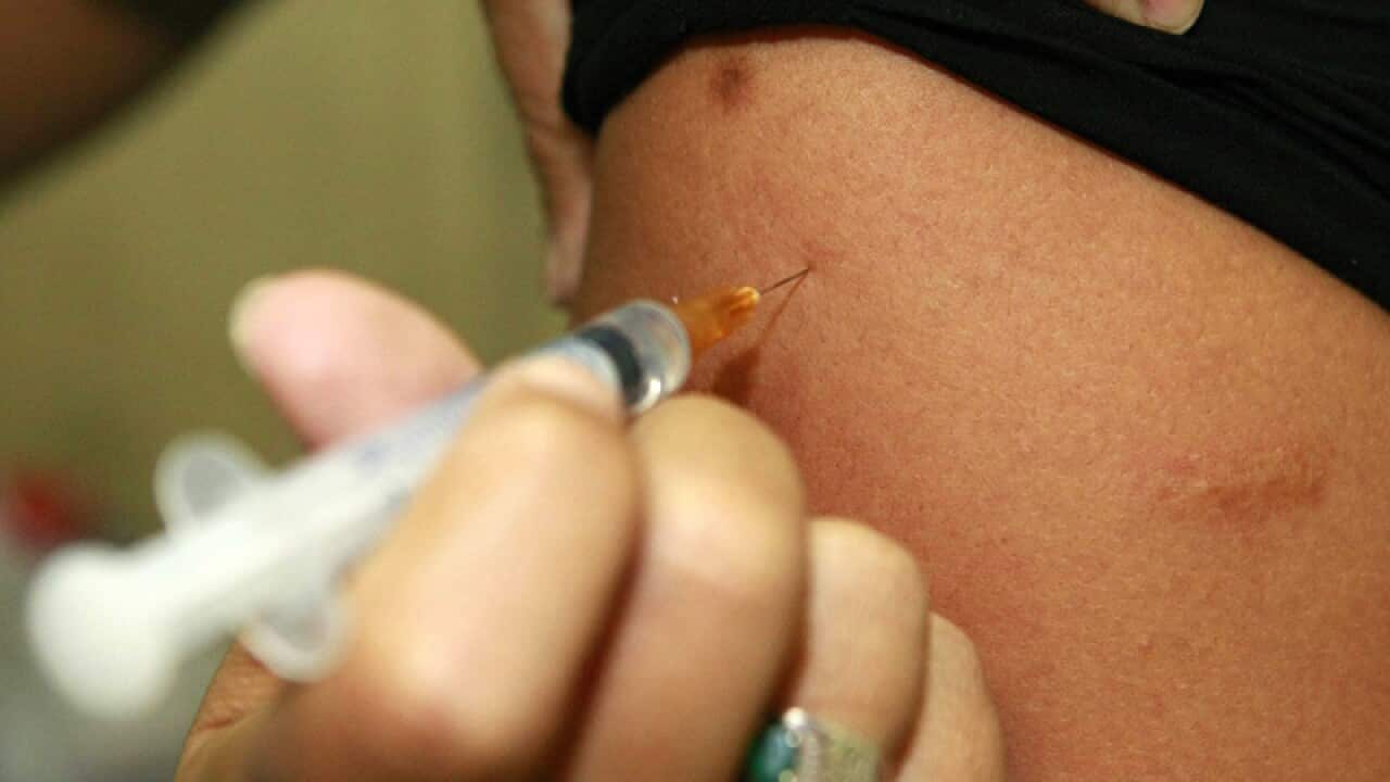 a person receiving a vaccine against the yellow fever