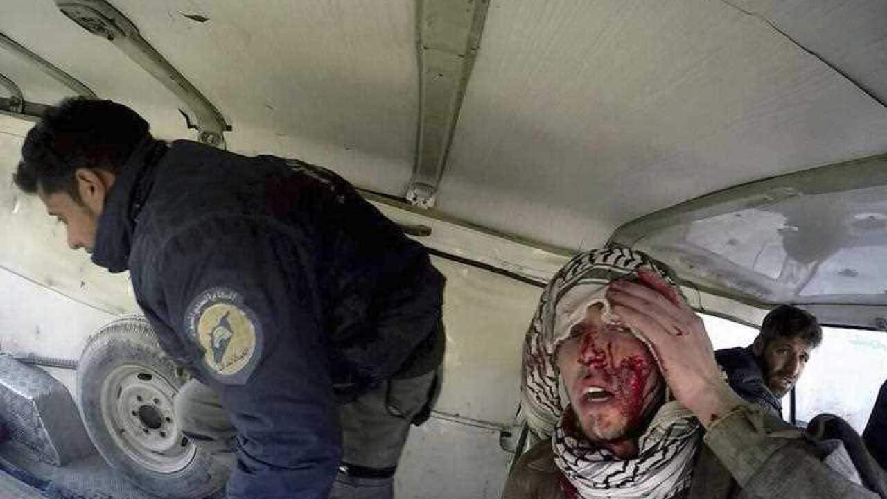 Injured people inside a Civil Defense van after airstrikes hit near Ghouta, a rebel-held suburb near Damascus, Syria.