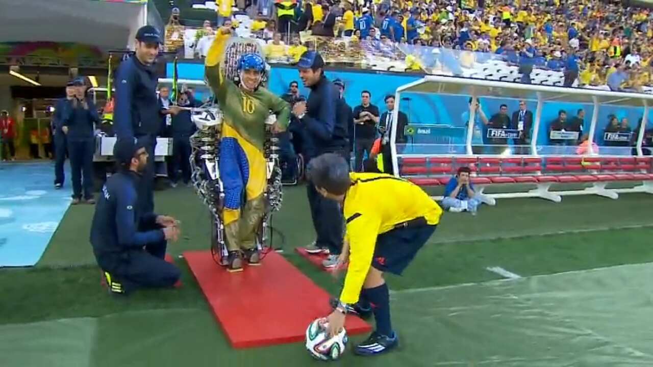 Kick Inn Paraplegic in robotic suit delivers first World Cup kick | SBS News