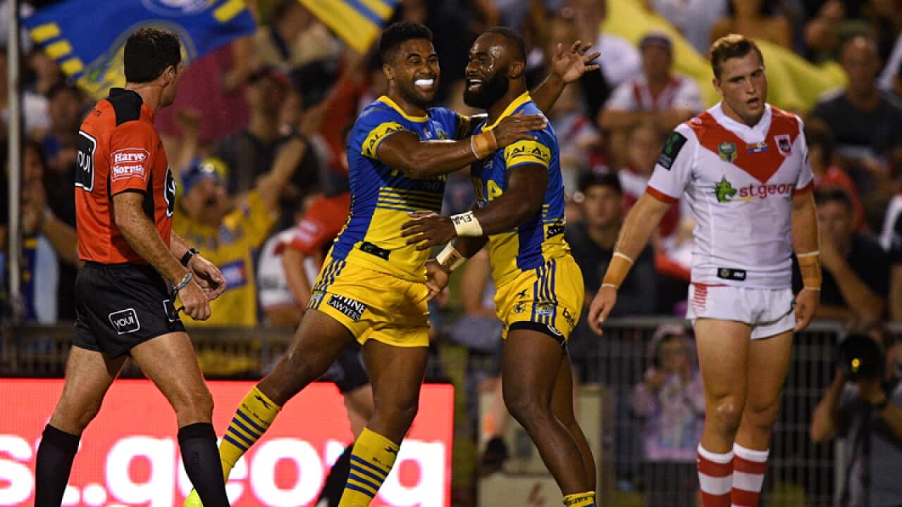 Semi Radradra of the Eels, (right), celebrates with Michael Jennings