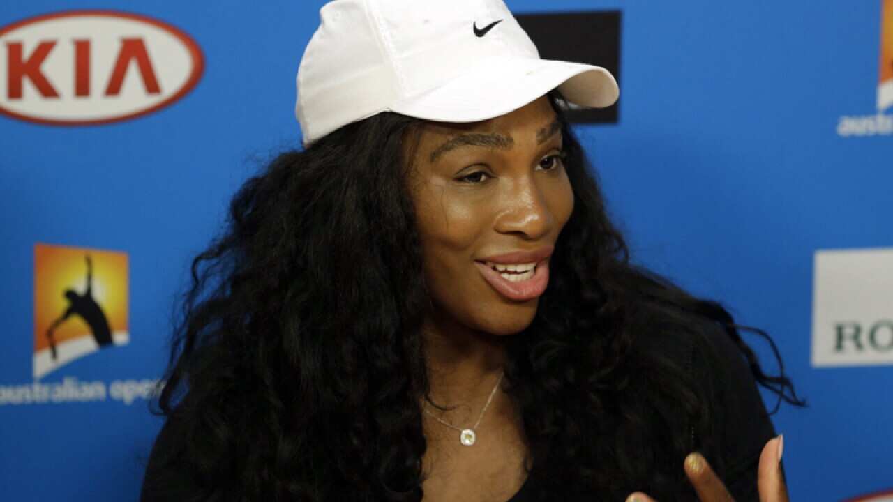 Serena williams of the US talks to the media