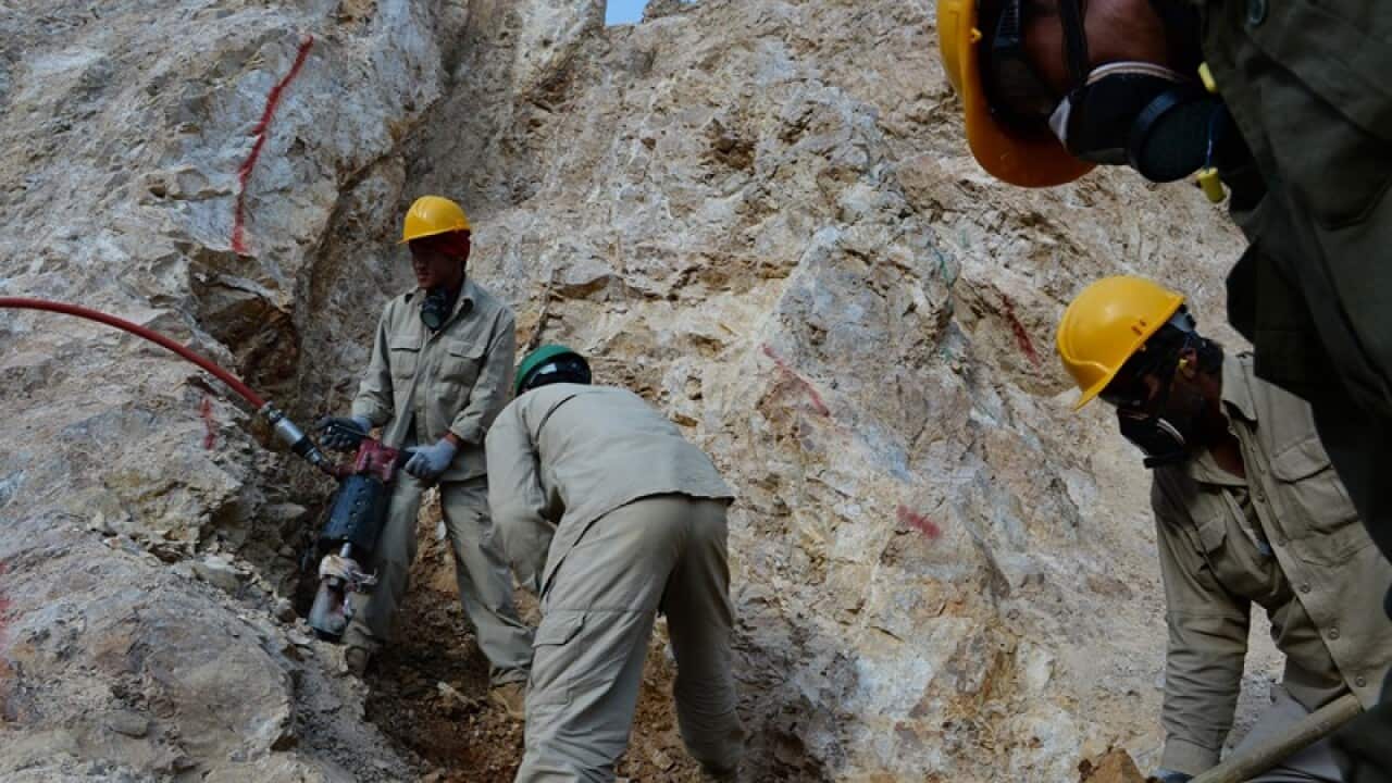 Afghan miners work at a gold mine on a mountainside near the village of Qara Zaghan in Baghlan province (file photo)