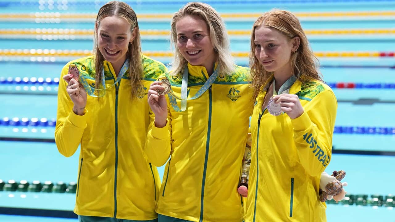 Bronze medalist Madison Wilson, gold medalist Ariarne Titmus and silver medalist Mollie O'Callaghan pose with their medals of the Women's 200 meters freestyle final at the 2022 Commonwealth Games.