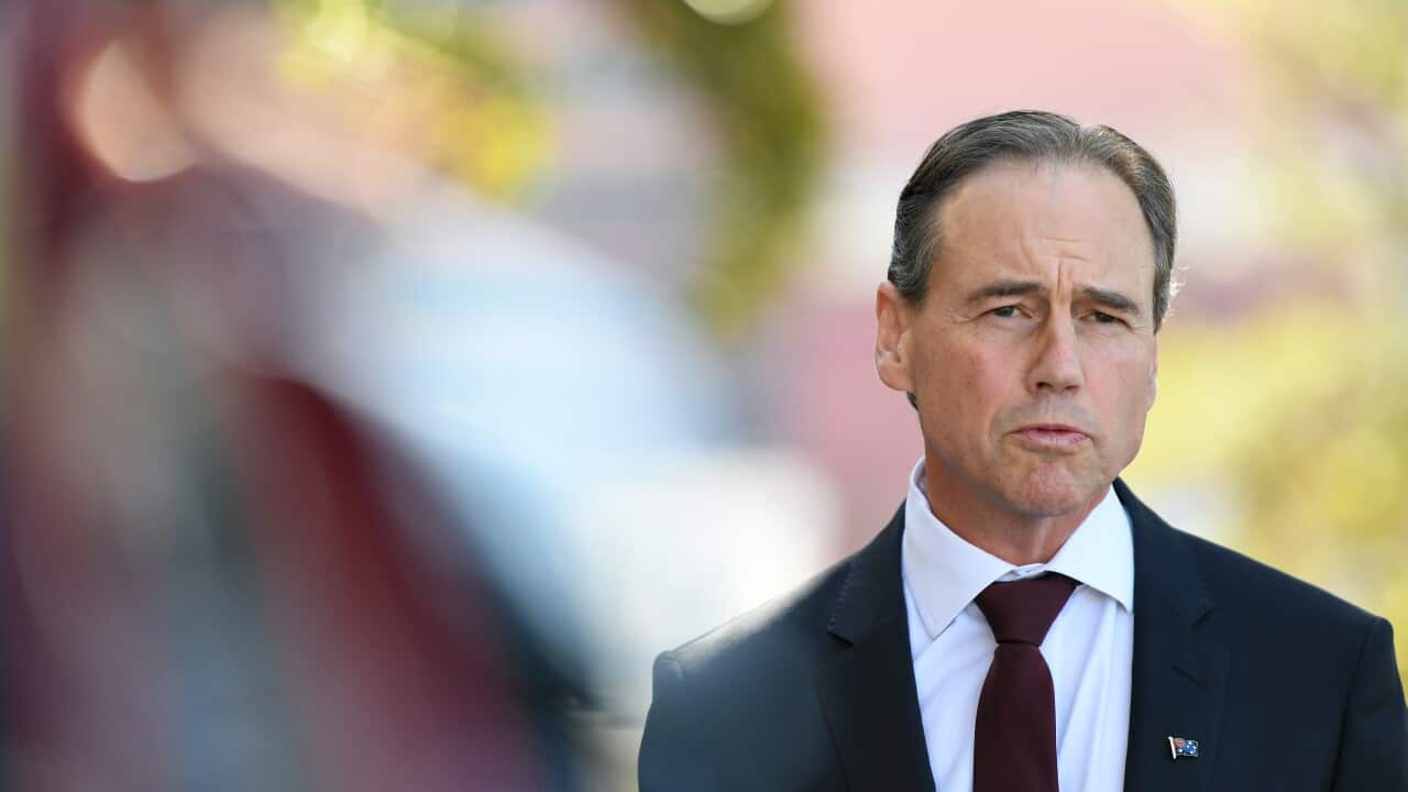 Australian Health Minister Greg Hunt speaks to media during a press conference.