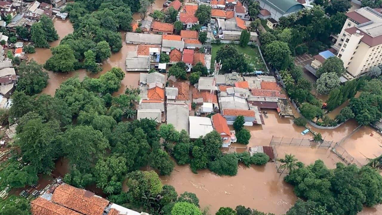 This handout aerial picture taken and released on January 1, 2020 by Indonesia's National Board for Disaster Management (BNPB) shows flooded houses and buildings following overnight rain in Jakarta. Photo by AFP