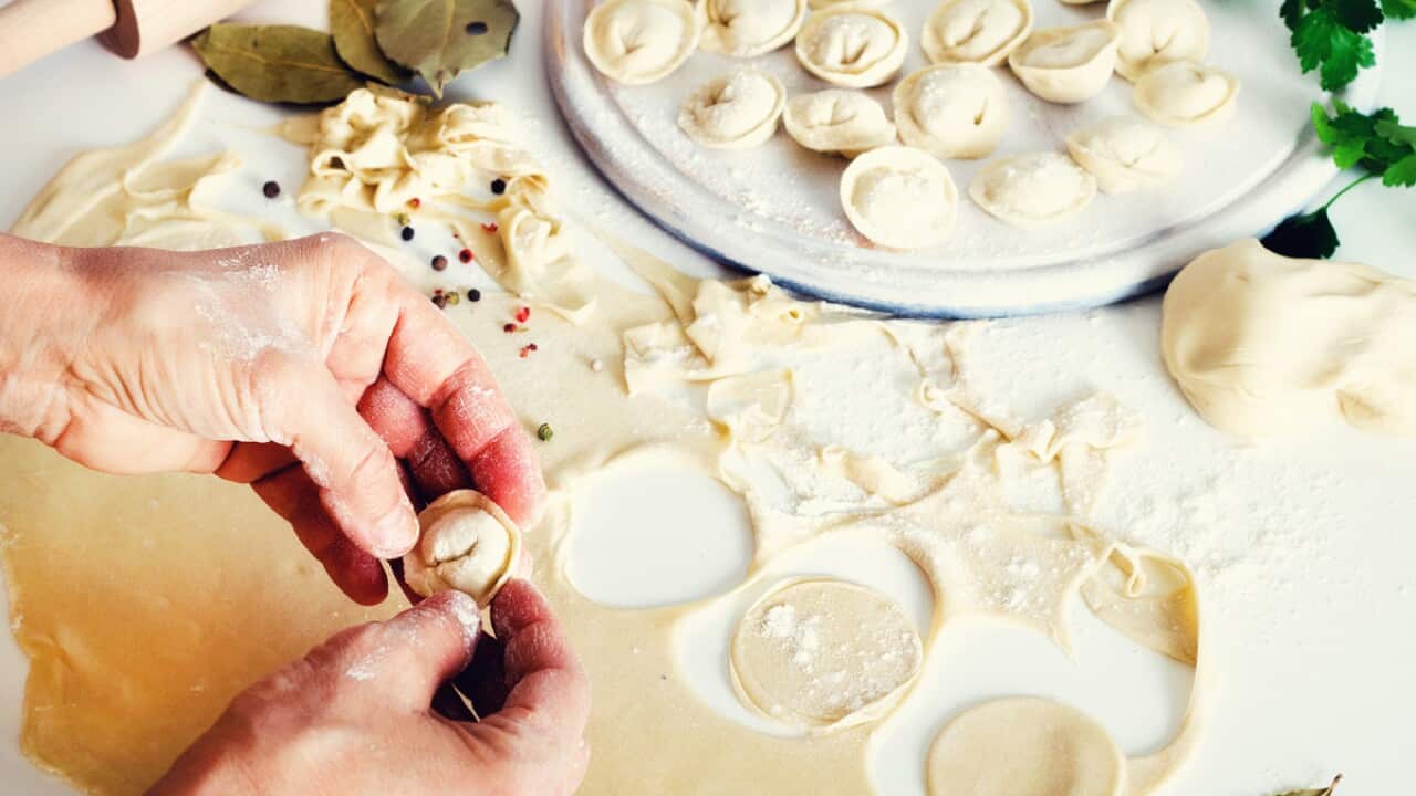 Traditional Russian pelmeni, ravioli, dumplings with meat