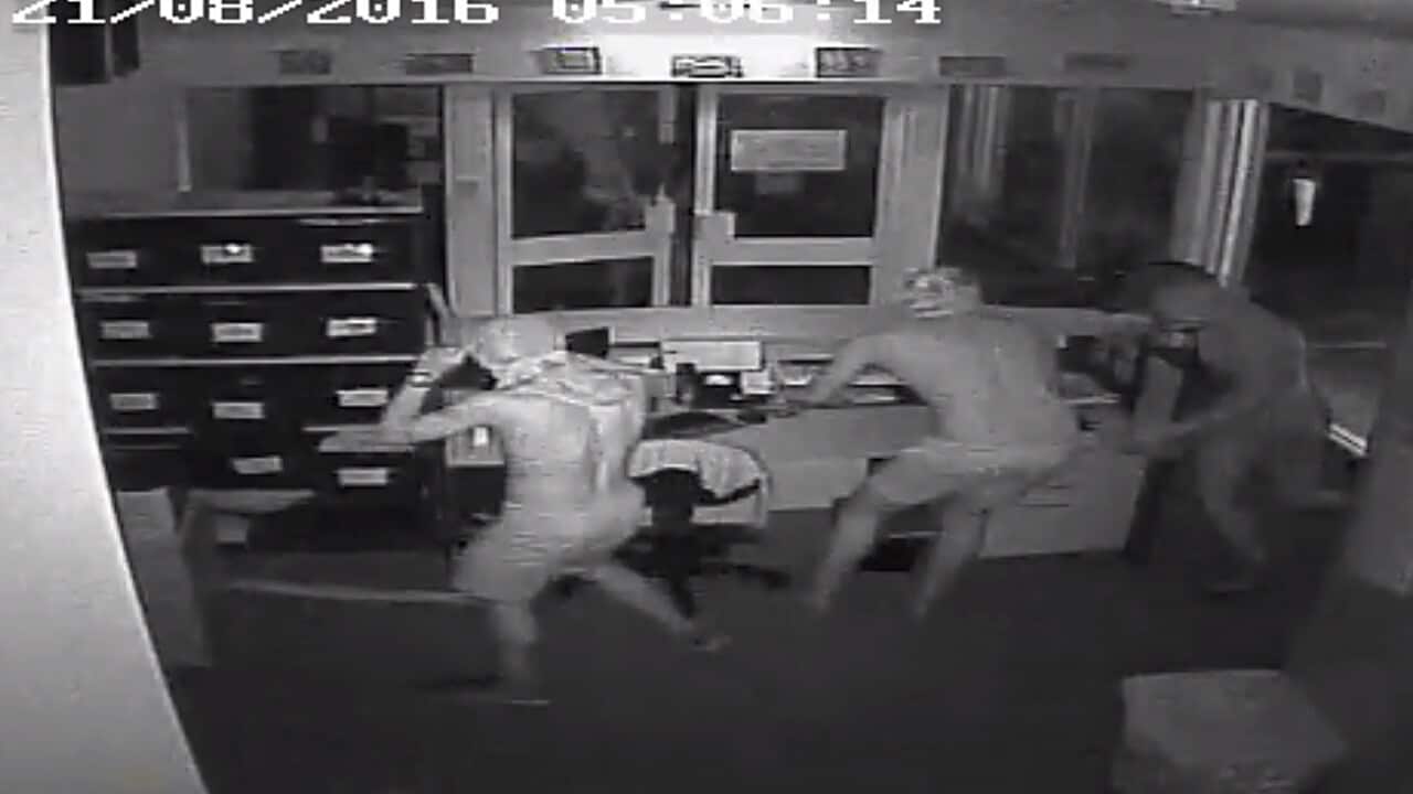 Four unidentified men captured on CCTV breaking in to Taminmin College in Humpty Doo in the Northern Territory on Sunday.