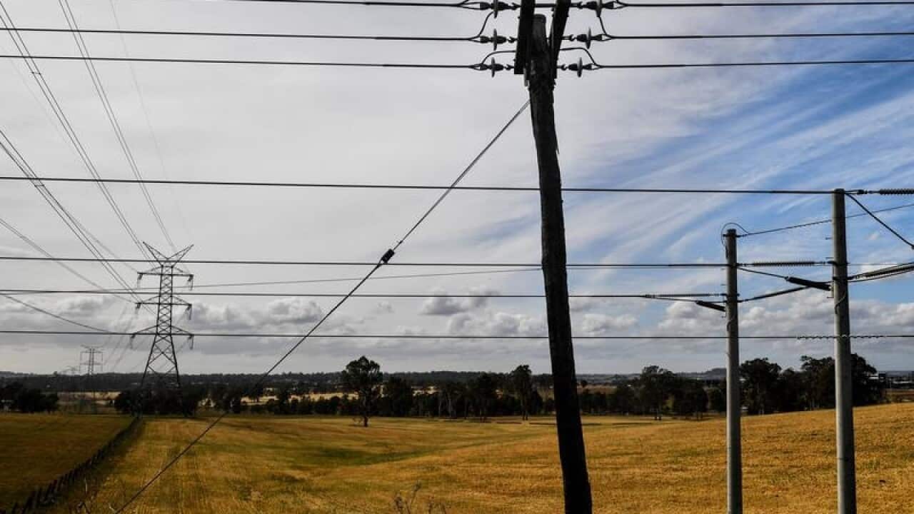 An electricity tower going through a rural property
