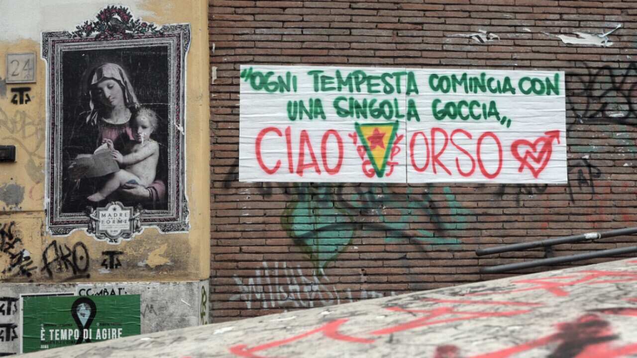 A banner in front of the a La Strada social center in memory of Lorenzo Orsetti, the Italian fighter killed by Isis in Baghuz, Syria.