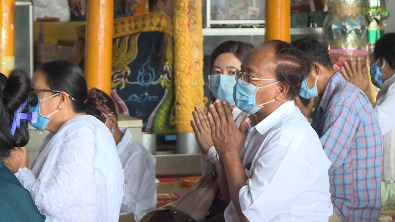 People wear mask in the temple in Cambodia