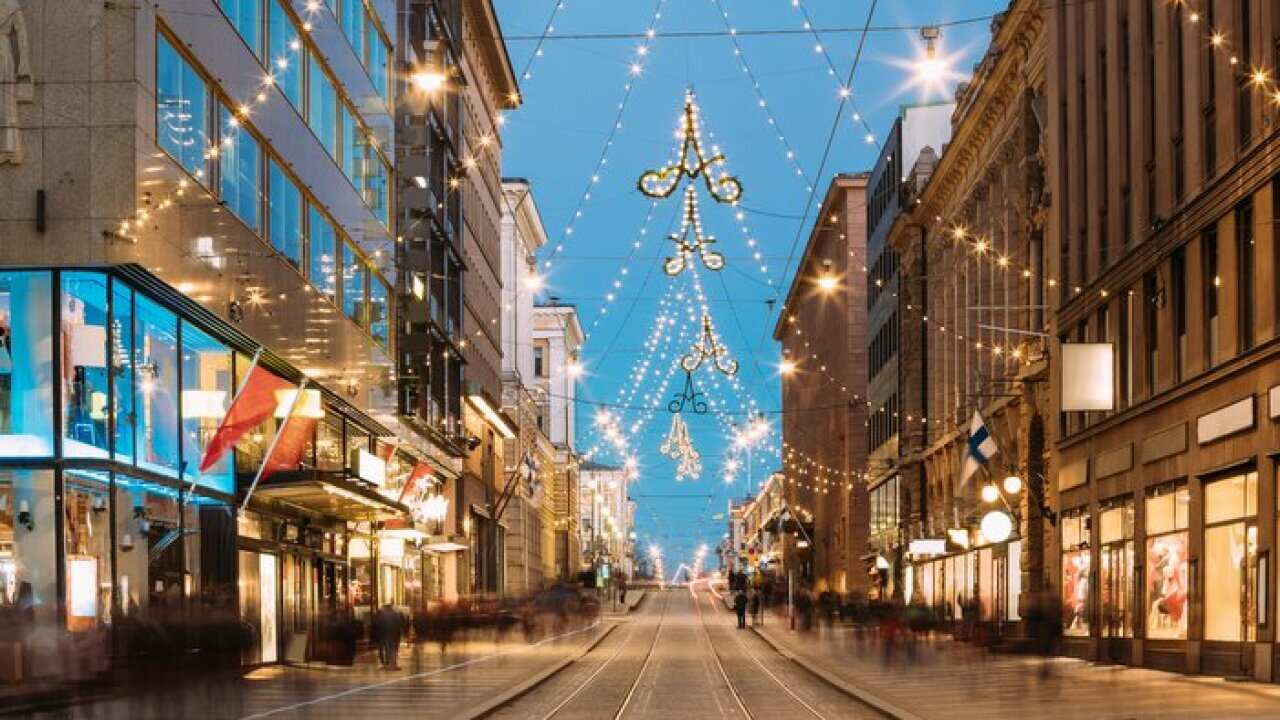 Helsinki, Finland. Night View Of Aleksanterinkatu Street With Railroad In Kluuvi District In Evening Christmas Xmas New Year Festive Illumination