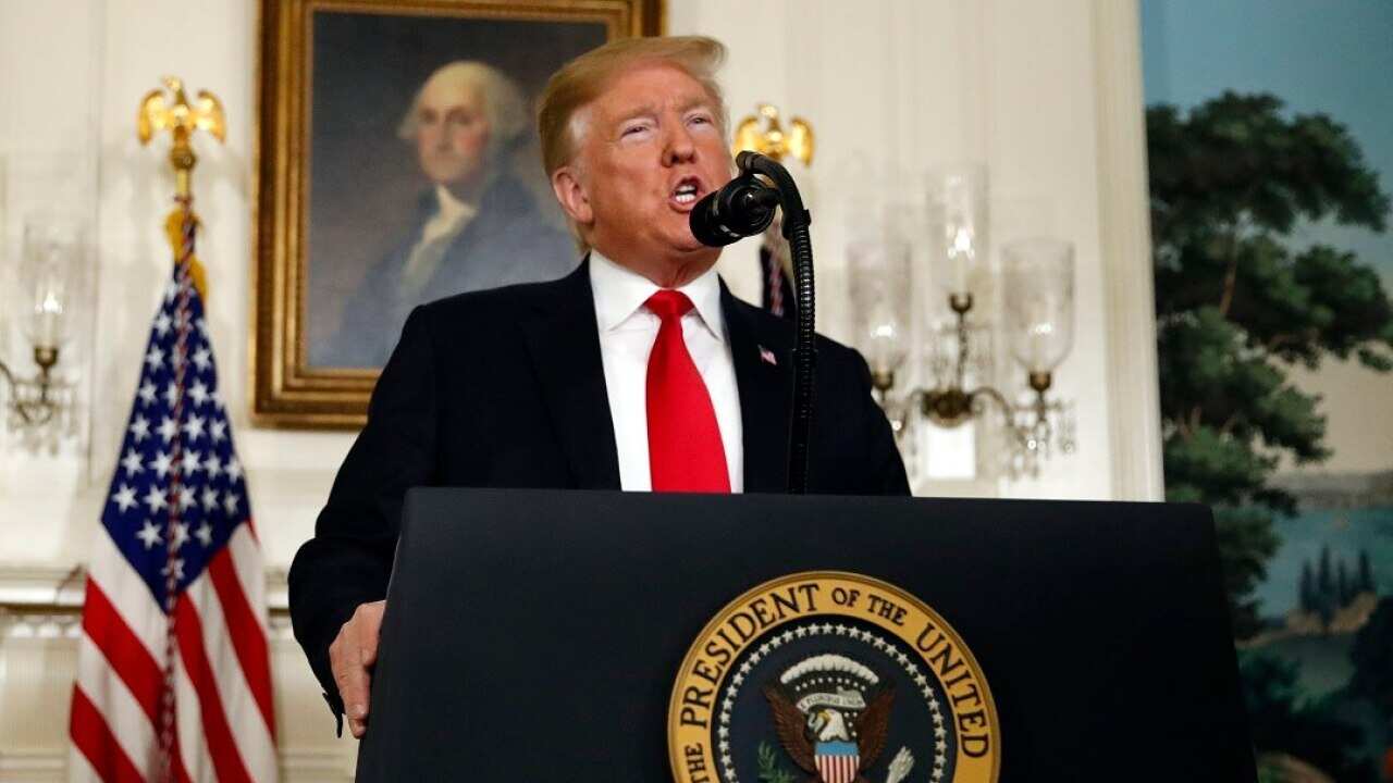 President Donald Trump speaks about the partial government shutdown, immigration and border security in the Diplomatic Reception Room of the White House, in Washington, Saturday, Jan. 19, 2019. (AP Photo/Alex Brandon)