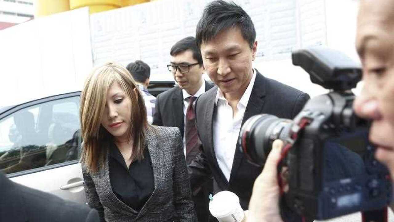 City Harvest Church pastor Kong Hee and his wife Ho Yeow Sun arrive at the state court in Singapore