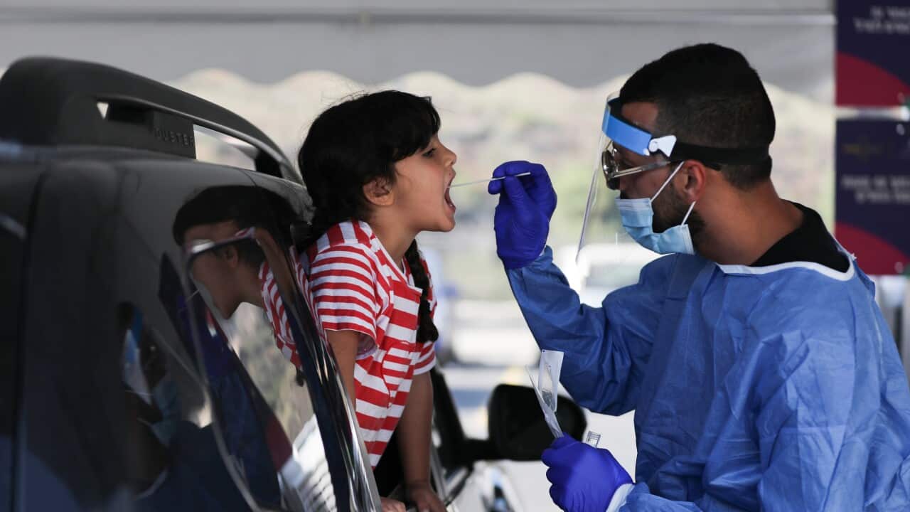 A child getting a COVID-19 test