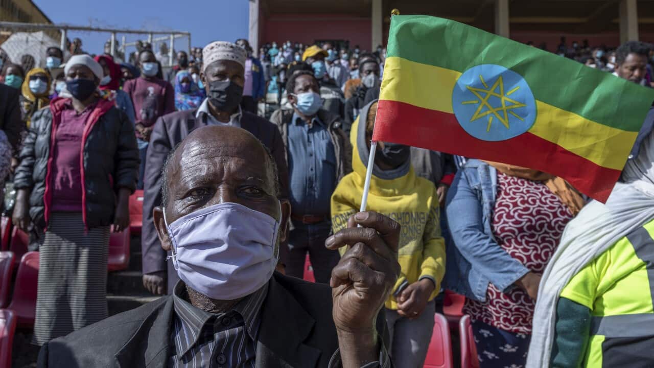 A man holds a national flag in the capital Addis Ababa, Ethiopia