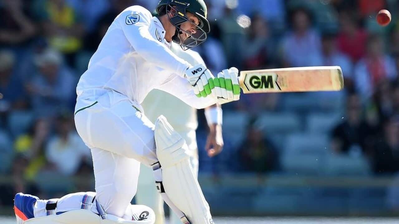 South African batsman Quinton de Kock hits to the boundary.