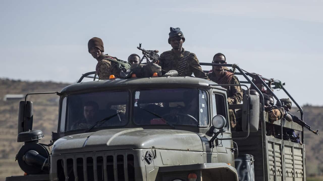 Ethiopian government soldiers ride in the back of a truck on a road near Agula, northern Ethiopia.