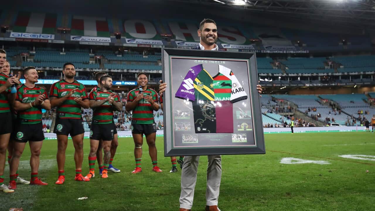 Greg Inglis poses with commemorative jersey