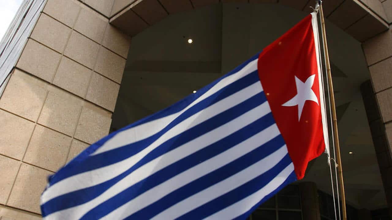 West Papuan asylum seekers raise the Morning-Star Flag outside the Department of Immigration Affairs in Melbourne, Friday, May 26, 2006.