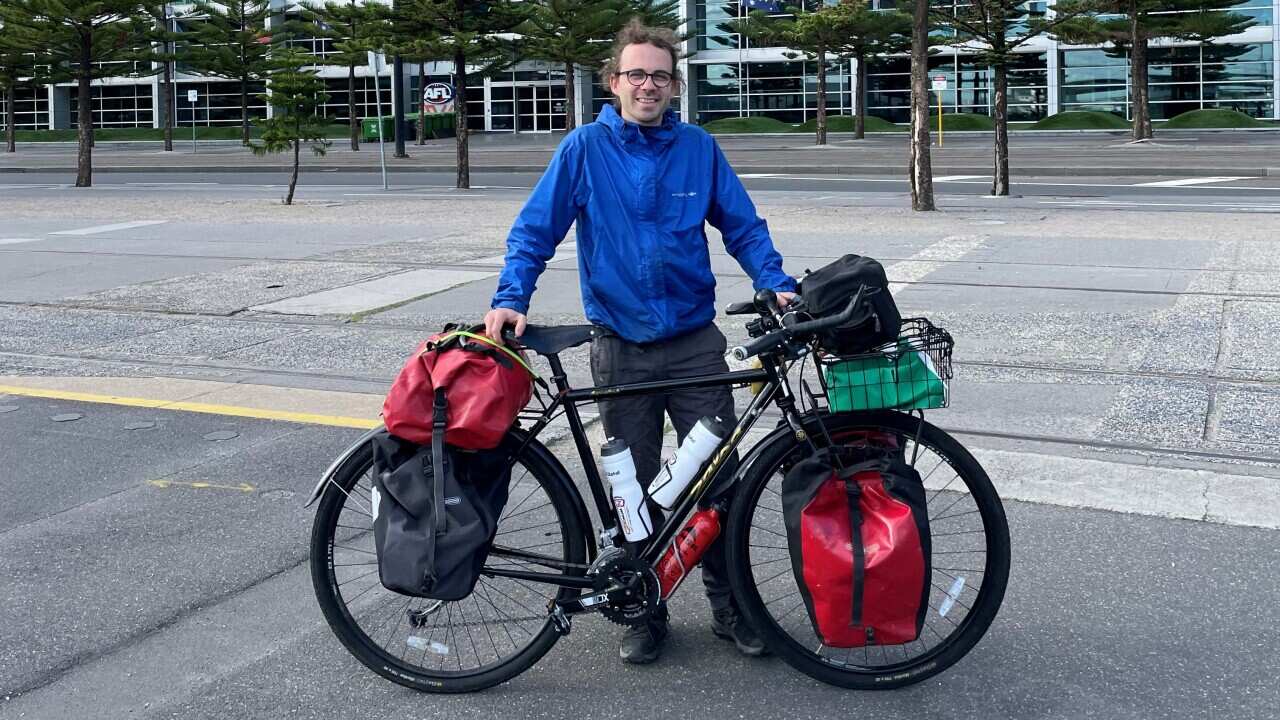 Gennaro Sposato with his bike in front of Marvel Stadium