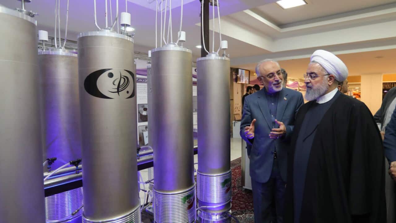 Iranian President Hassan Rouhani (R) inspecting nuclear technology on the occasion of Iran National Nuclear Technology Day in Tehran, Iran, 9 April 2019