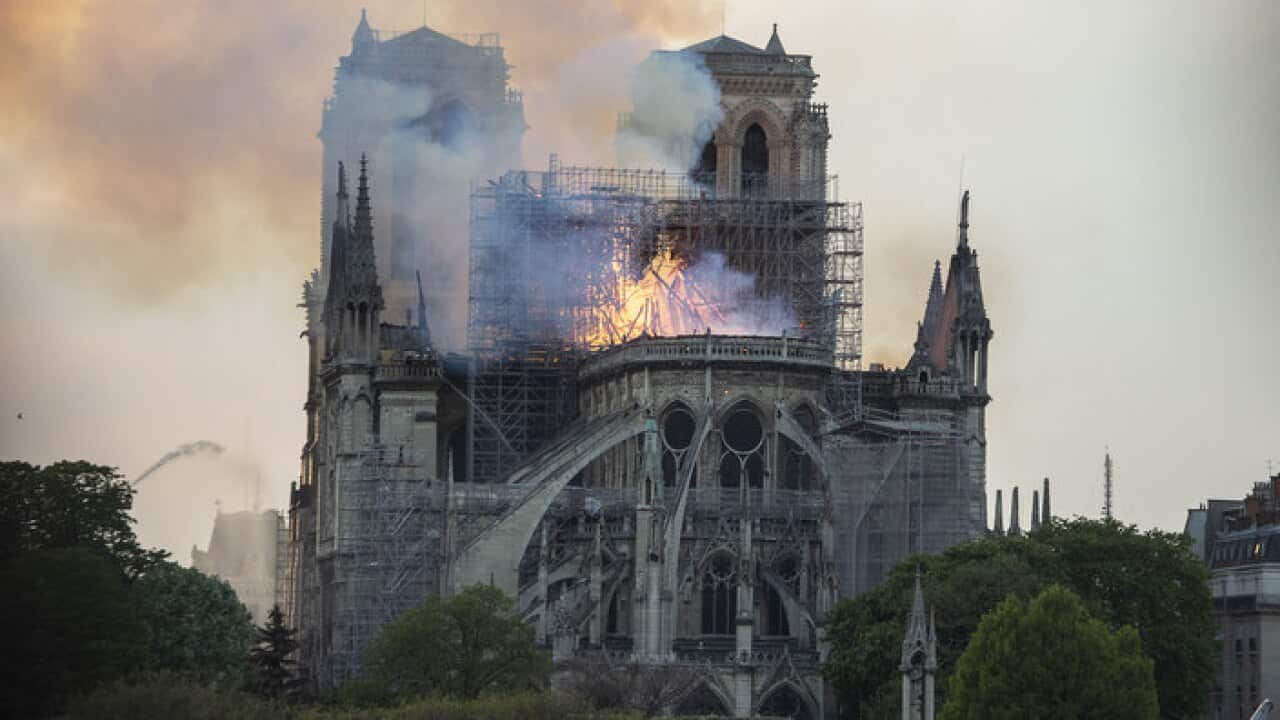 Smoke and flames rise during a fire at the landmark Notre-Dame Cathedral in central Paris on April 15, 2019, potentially involving renovation works being carried out at the site, the fire service said. Photo by Eliot Blondet /ABACAPRESS.COM.