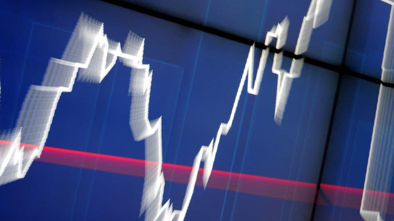 An information board illustrates movements in share prices